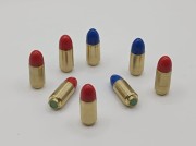 ZBIJAK - Łuska MOS kal. 9x19mm Luger BEZ KRYZY, pocisk kolor, atrapa naboju bez prochu i spłonki (Zbijak 9x19 Bez Kryzy Łuska Mosiężna)